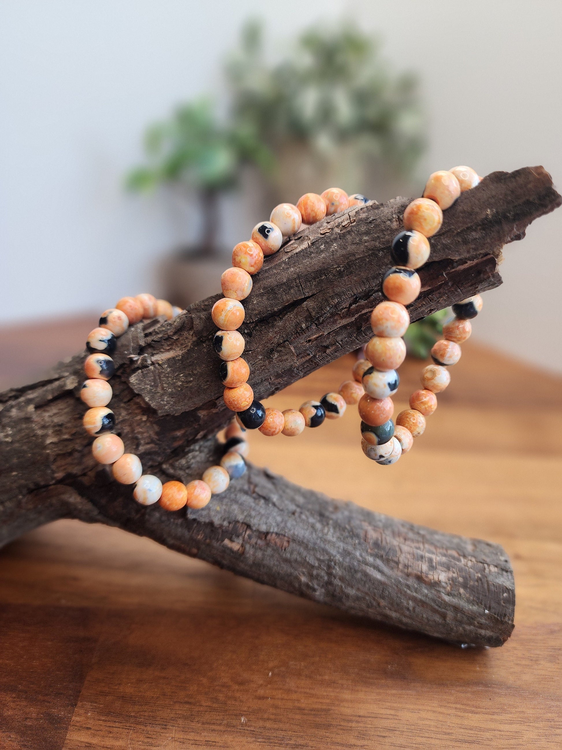 Orange Dream Black Agate Crystal Bracelet | 8MM Agalmatolite Beads | Orange, Black, White | Halloween Jewelry for Spooky Season & Summerween