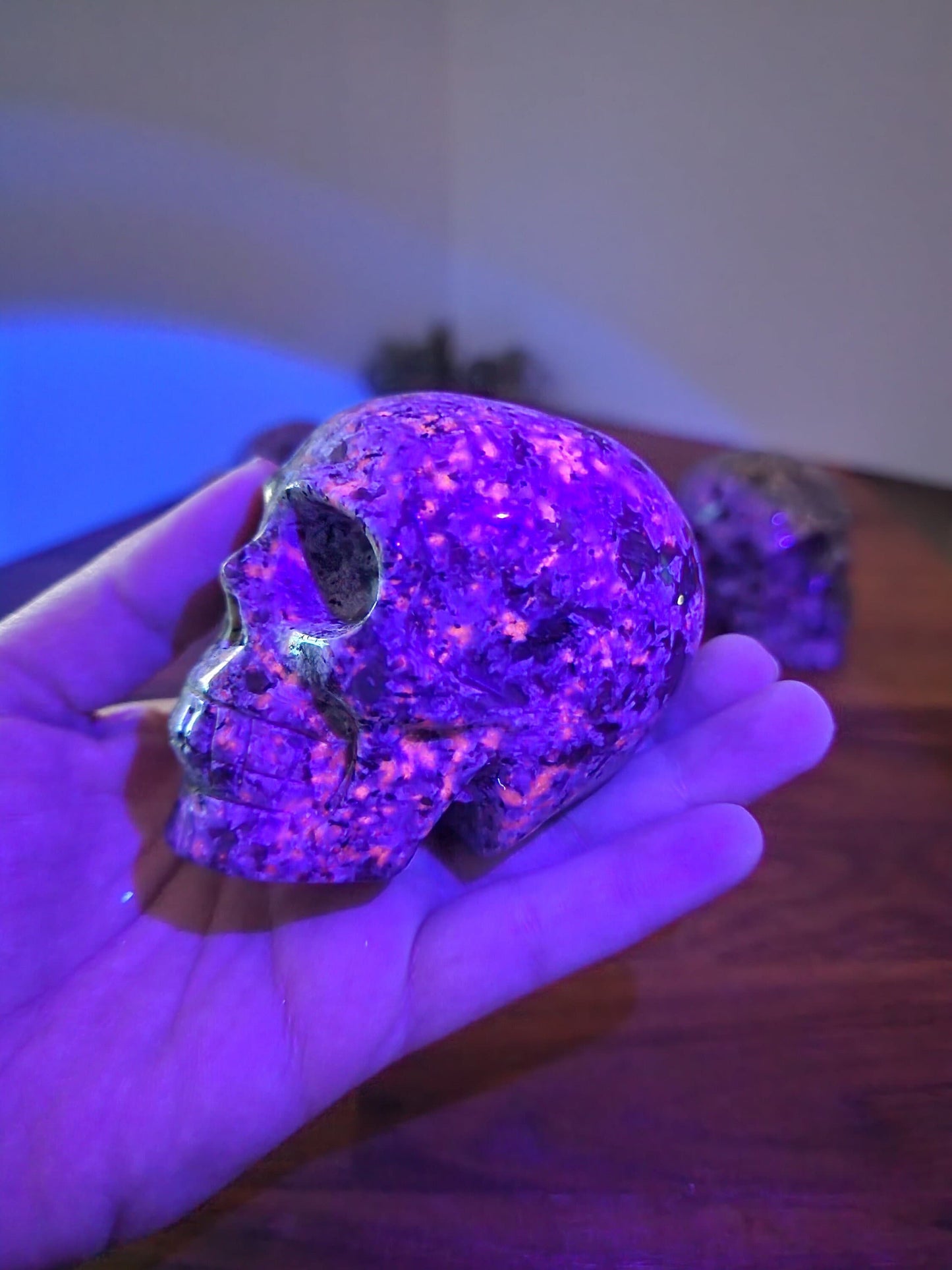 Spooky Crystal Yooperlite Skull Carving. Perfect for the UV reactive crystals lover or for a Halloween blacklight display. Dark Academia awaits!