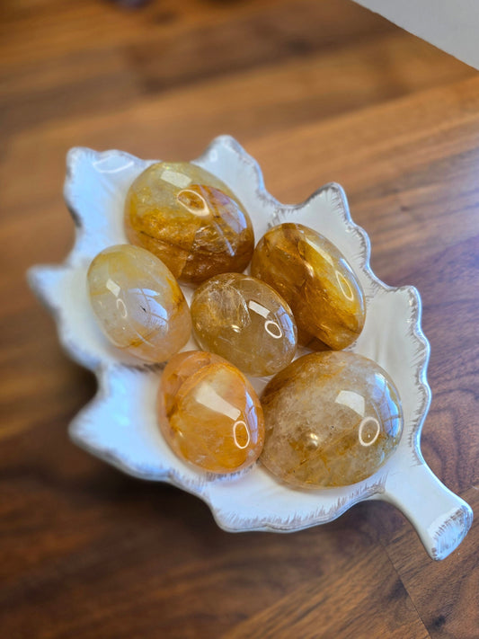 Gorgeous Golden Healer Palm Stones full of golden strands and crystal rainbows. Unique Hematoid Quartz pocket fidgets for adults and kids alike.