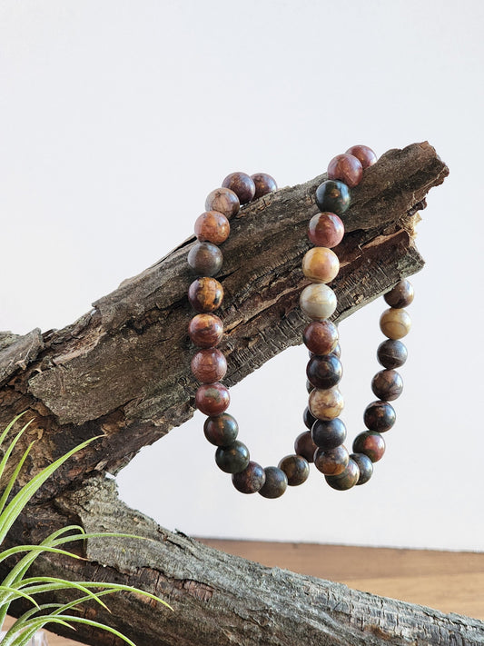 Colorful Piccaso Jasper bracelet with 8mm beads in deep hues of Reds, Oranges, Yellows,and Greens on a stretchy elastic bracelet for comfort.