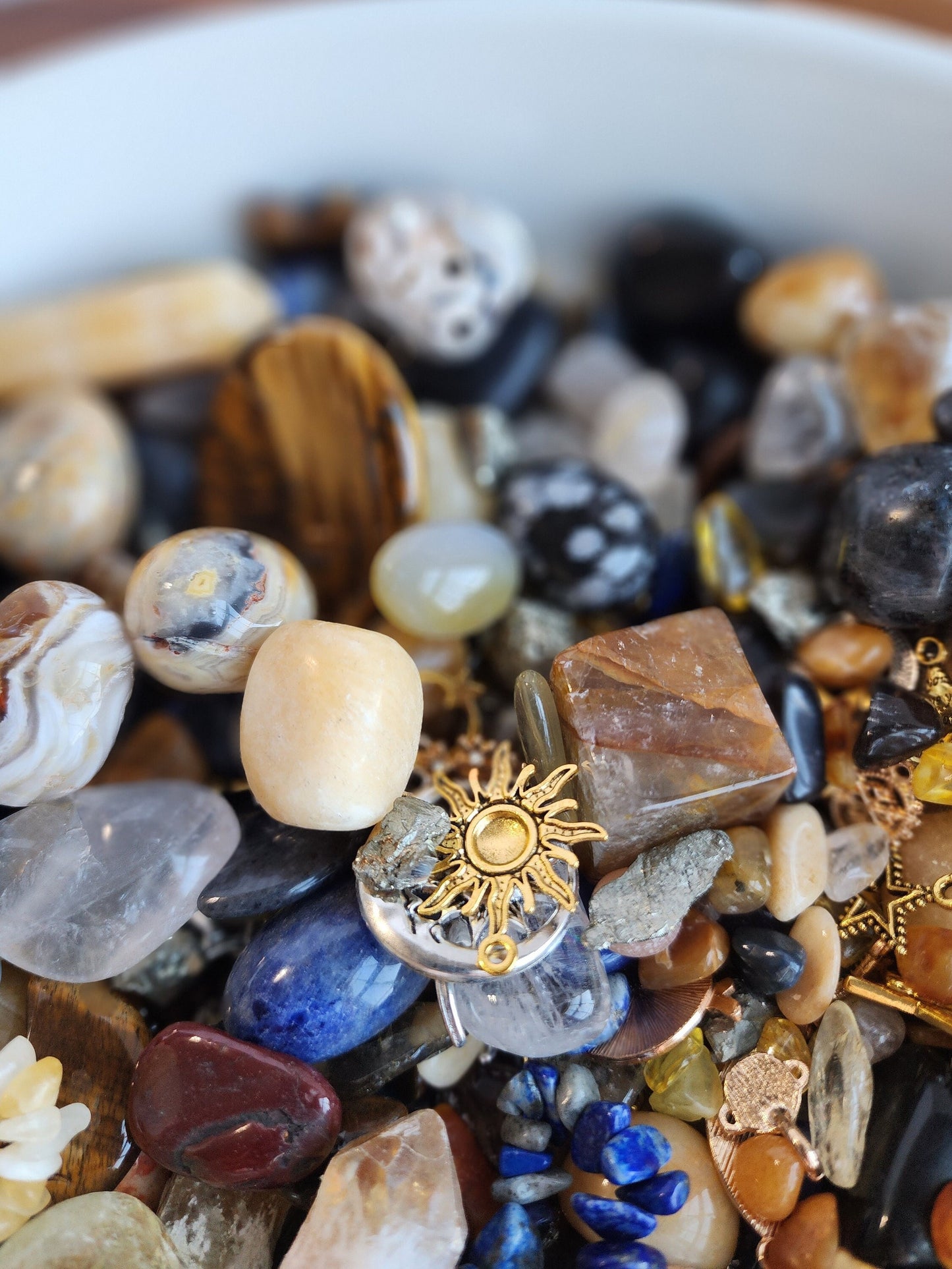 The Gold Celestial Crystal Confetti features deep blues, yellow suns, sodalite crystal bracelets, tiger eye worry stones, golden healer cubes, and many other crystals to connect you to the heavens. Get your crystal scoop today!