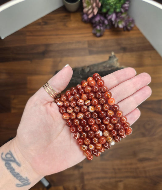 Gorgeous High Quality Carnelian Bracelets with 8mm crystal beads. These bestsellers are listed as a bracelet favorite for $5.55. Amazing Banded Red and Orange agate jewelry.