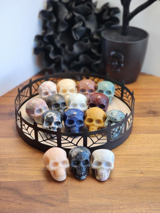 Crystal Skulls in lots of colors and materials. Larger 2&quot; width makes them a great addition to any Halloween or Spooky season decor.