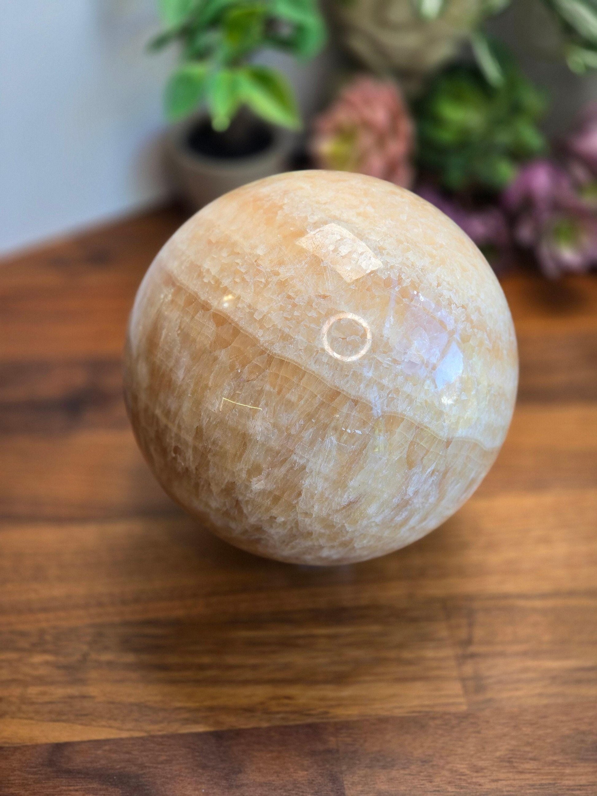 Huge 150mm & almost 6" orange calcite sphere. Gorgeous rainbows, banding and patterns throughout. Sunset glow large crystal statement piece for beachy orange decor.