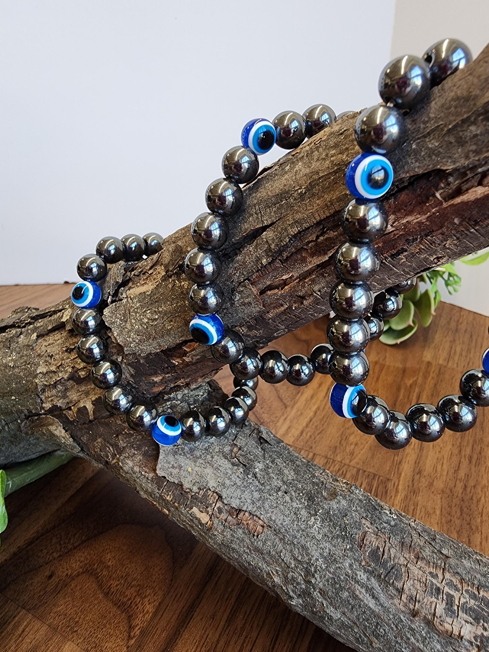 Evil Eye Hematite Bracelet: 8MM Tera Hertz Beads with Blue & Black Protection Charms