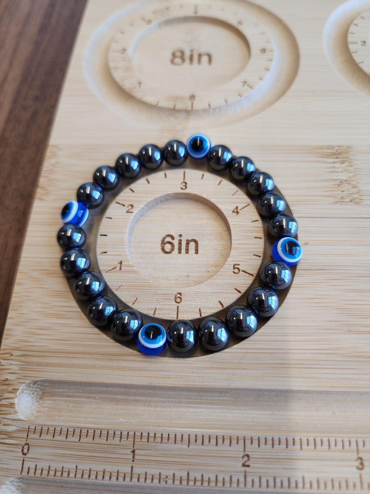 Evil Eye Hematite Bracelet: 8MM Tera Hertz Beads with Blue & Black Protection Charms