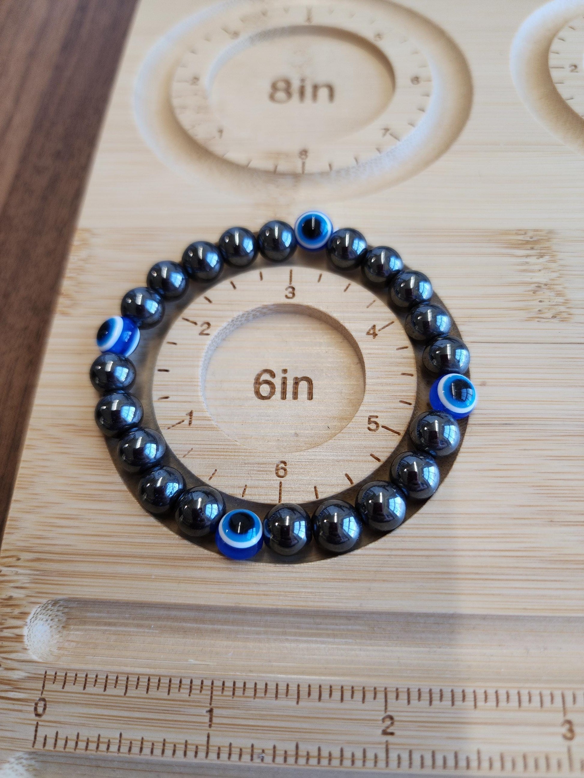 Evil Eye Hematite Bracelet: 8MM Tera Hertz Beads with Blue & Black Protection Charms