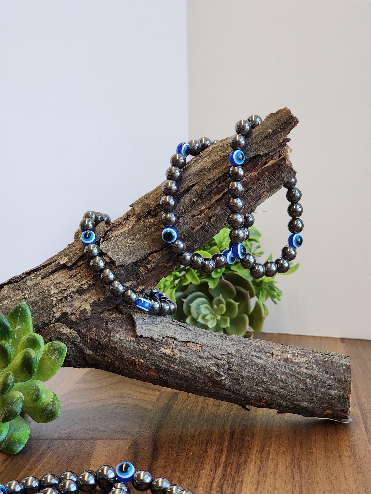 Evil Eye Hematite Bracelet: 8MM Tera Hertz Beads with Blue & Black Protection Charms