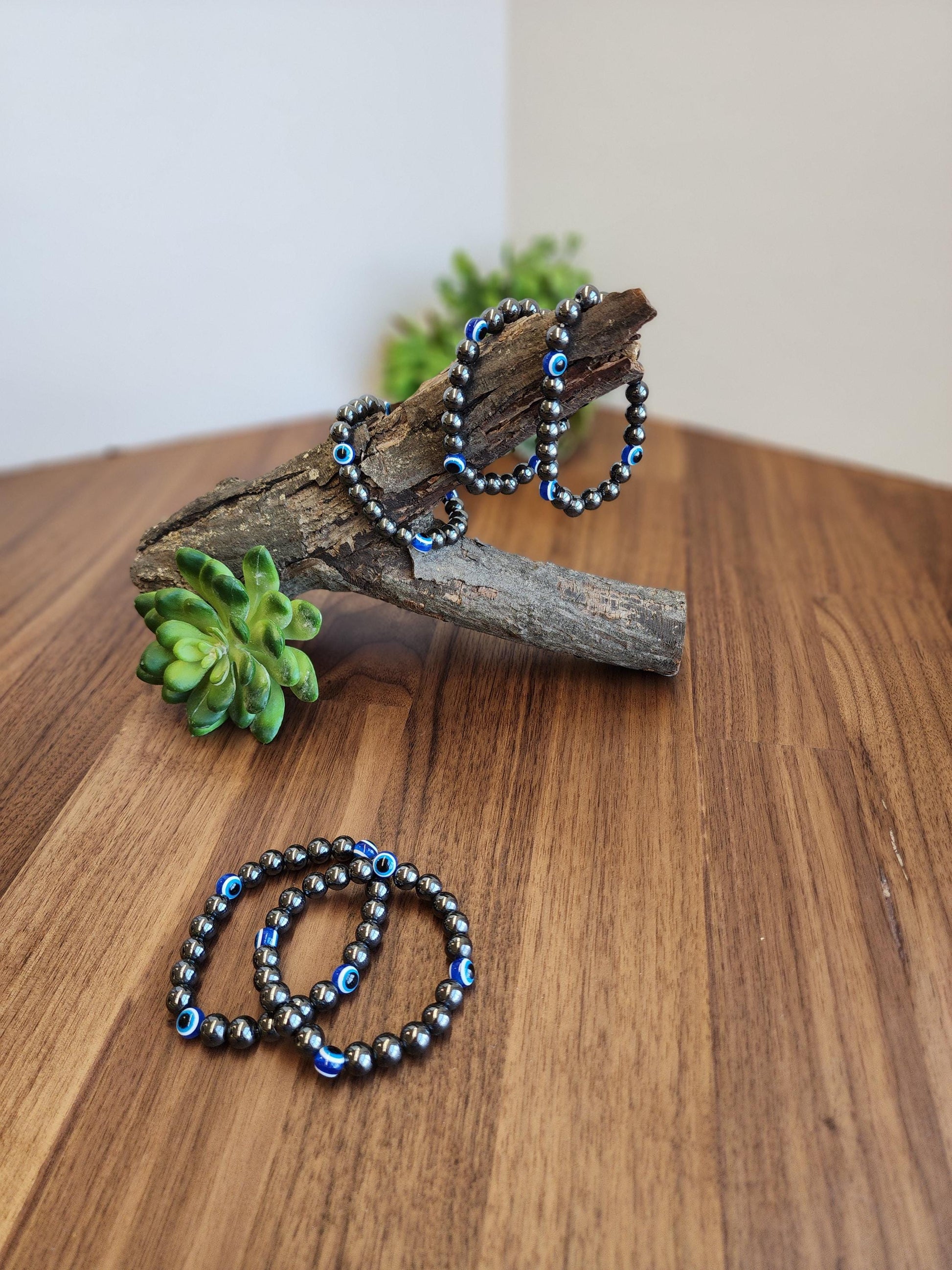 Evil Eye Hematite Bracelet: 8MM Tera Hertz Beads with Blue & Black Protection Charms