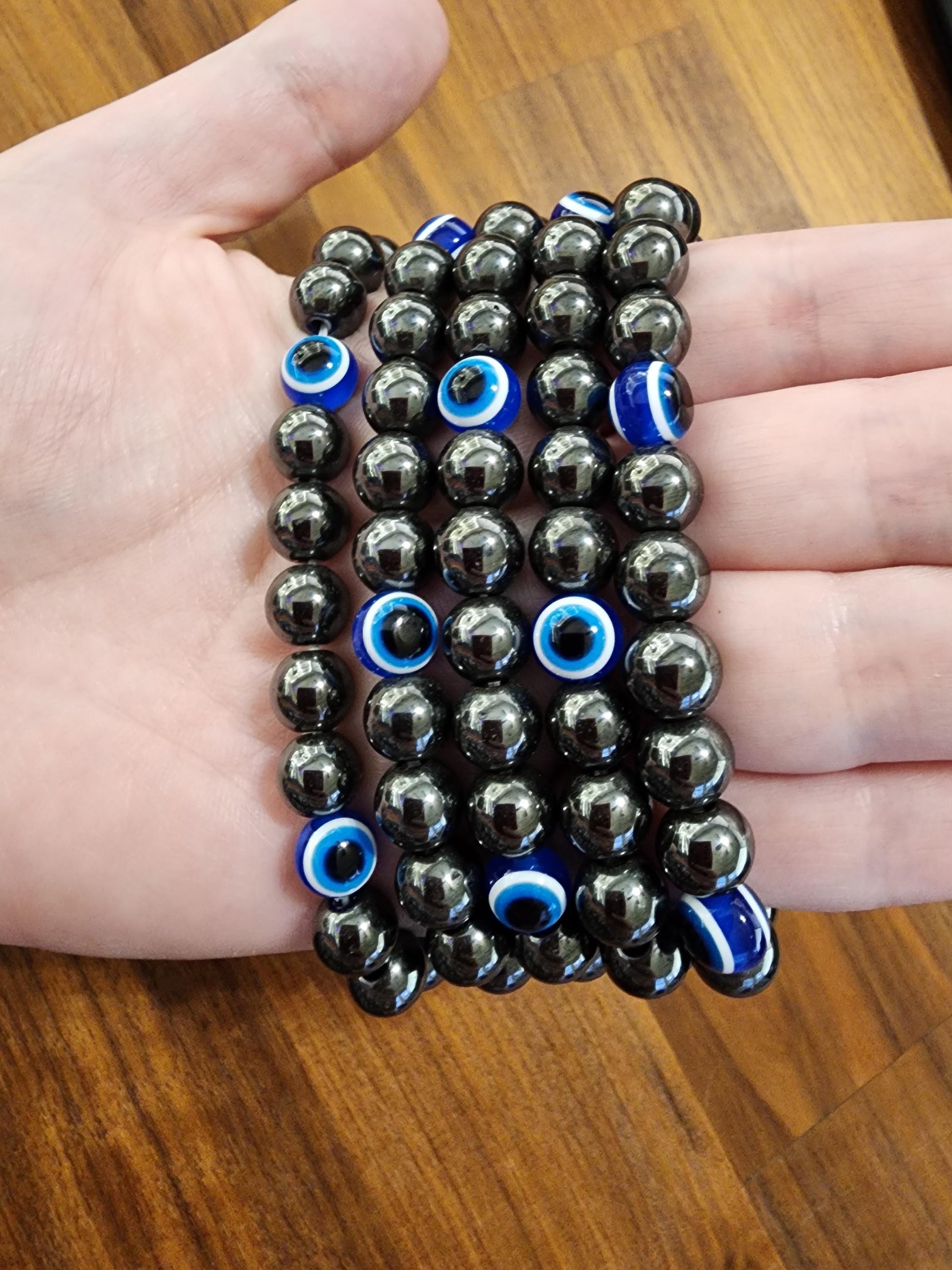 Evil Eye Hematite Bracelet: 8MM Tera Hertz Beads with Blue & Black Protection Charms