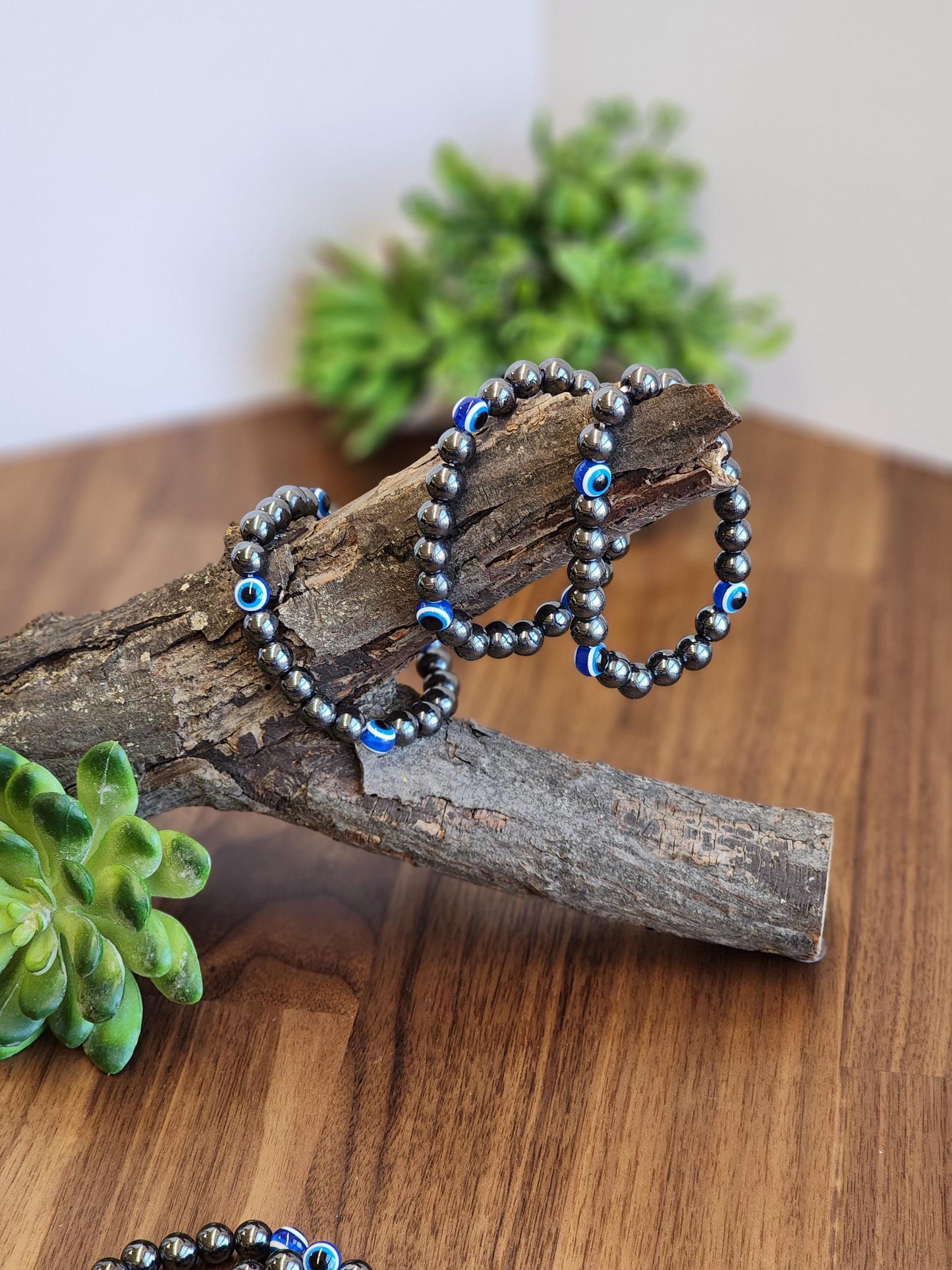 Evil Eye Hematite Bracelet: 8MM Tera Hertz Beads with Blue & Black Protection Charms