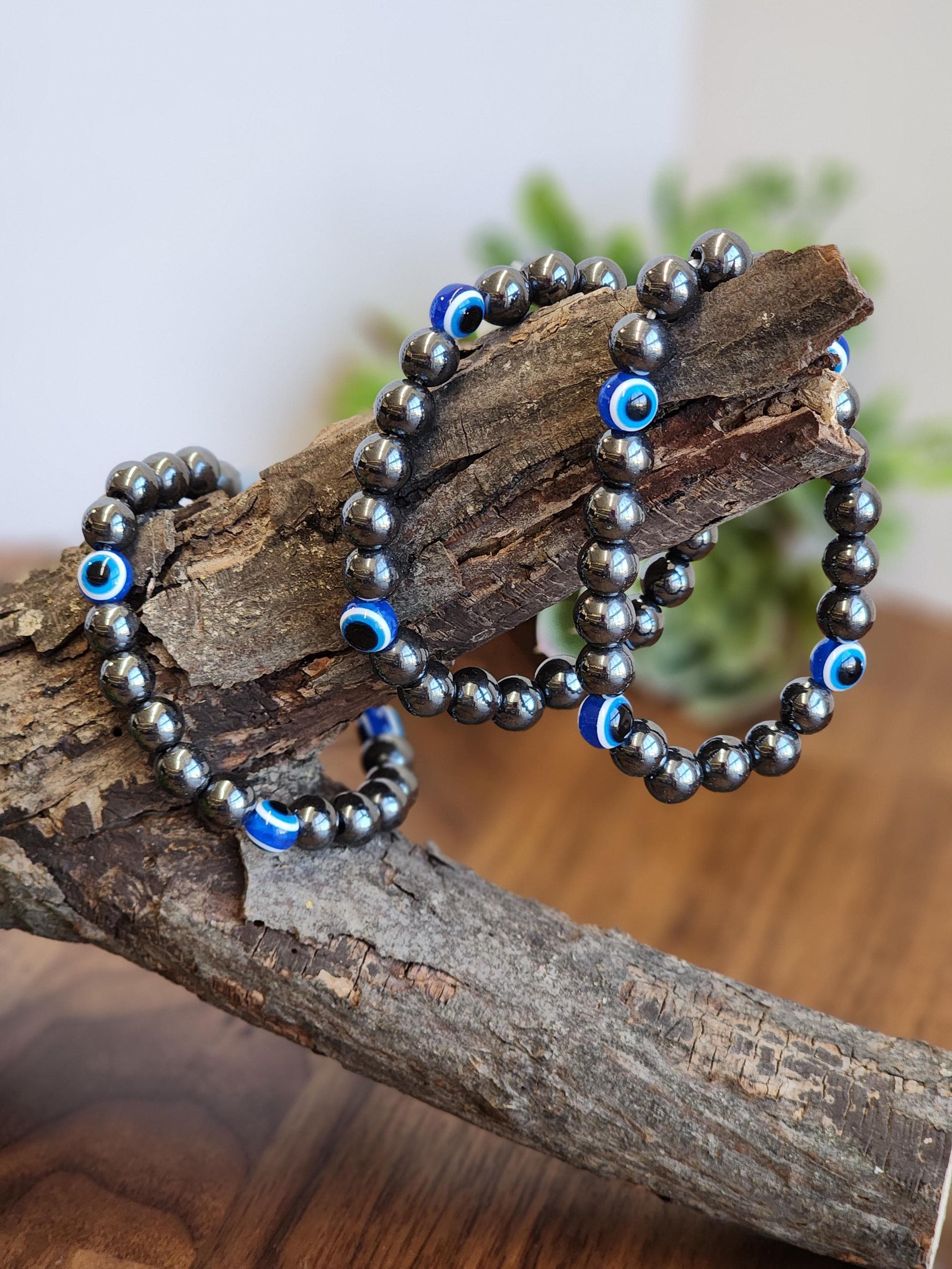 Evil Eye Hematite Bracelet: 8MM Tera Hertz Beads with Blue & Black Protection Charms
