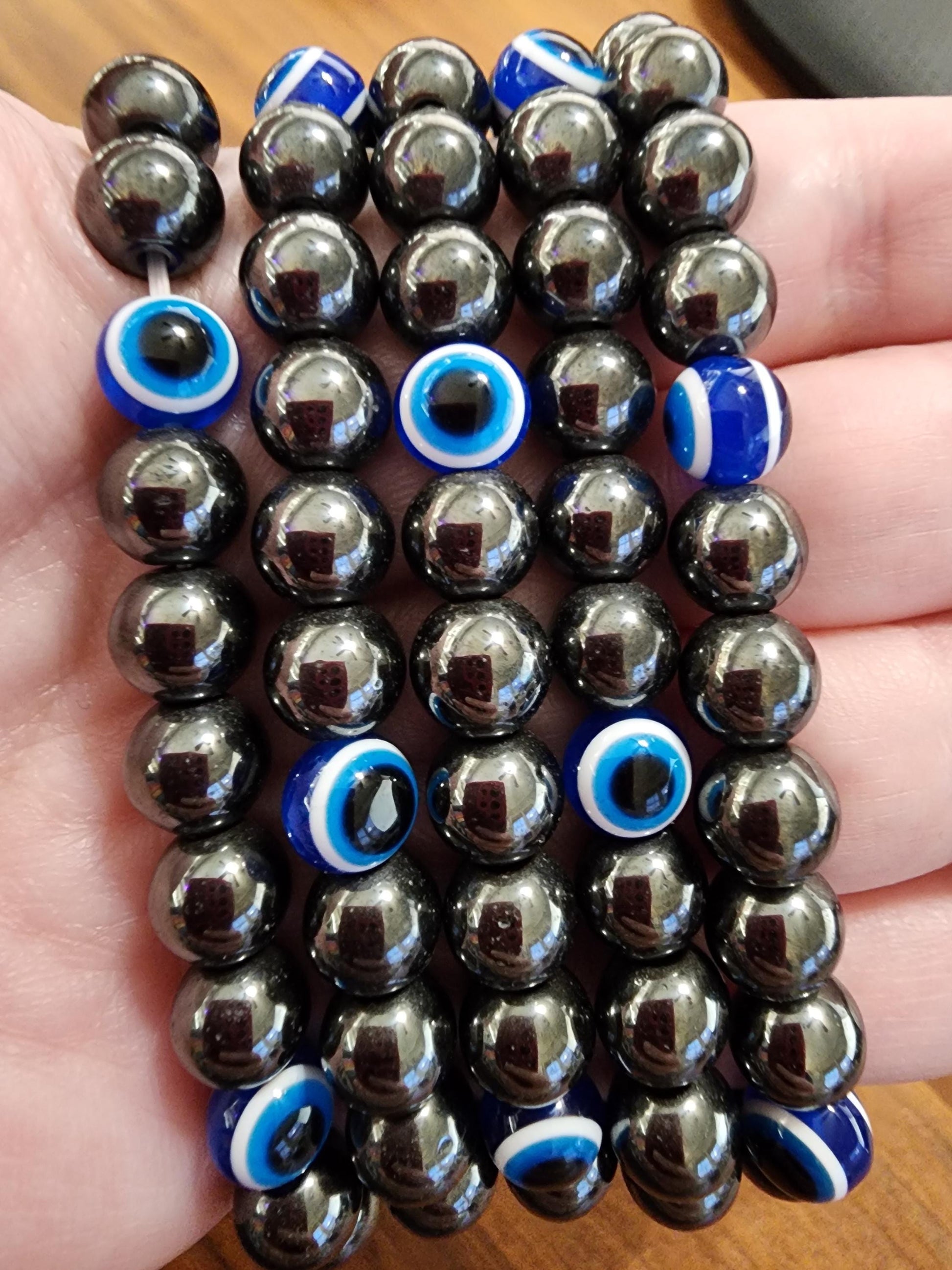 Evil Eye Hematite Bracelet: 8MM Tera Hertz Beads with Blue & Black Protection Charms