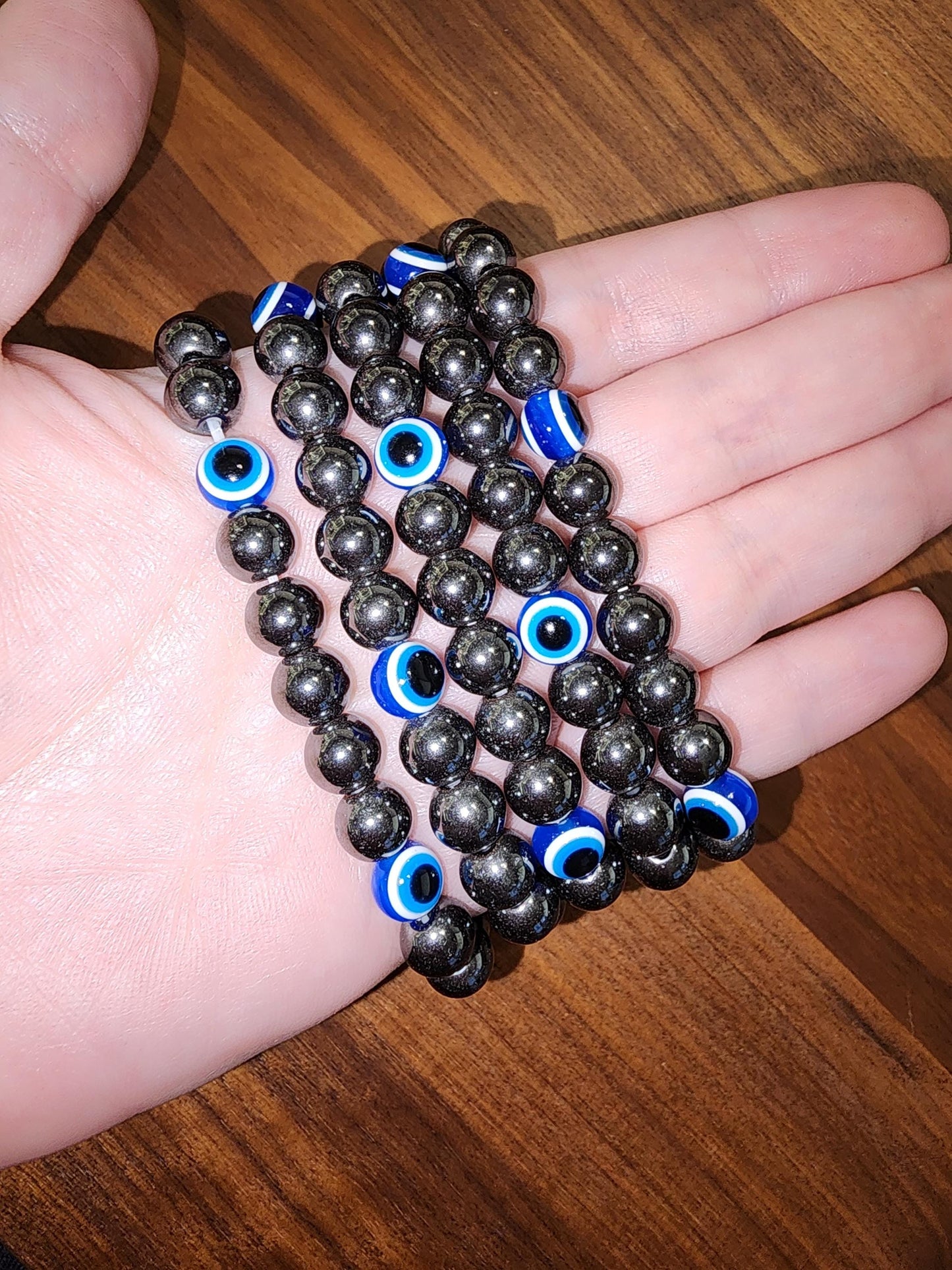 Evil Eye Hematite Bracelet: 8MM Tera Hertz Beads with Blue & Black Protection Charms