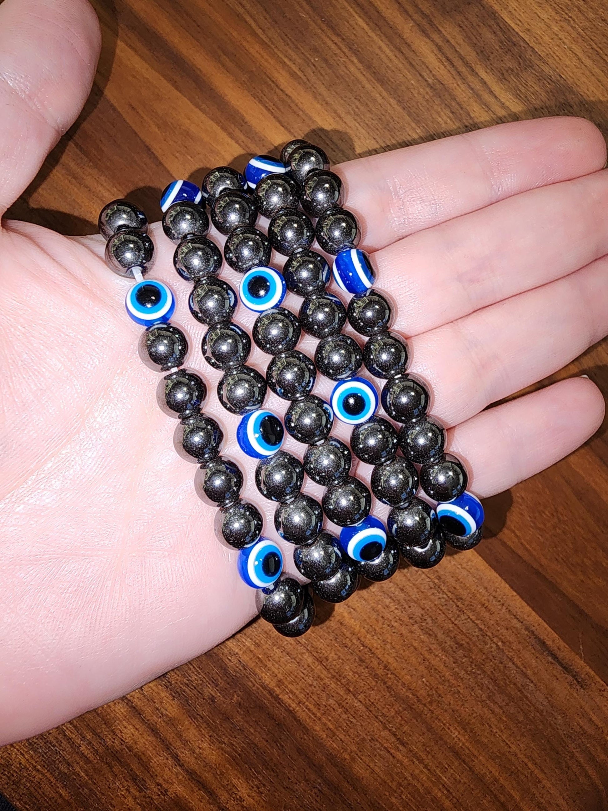 Evil Eye Hematite Bracelet: 8MM Tera Hertz Beads with Blue & Black Protection Charms