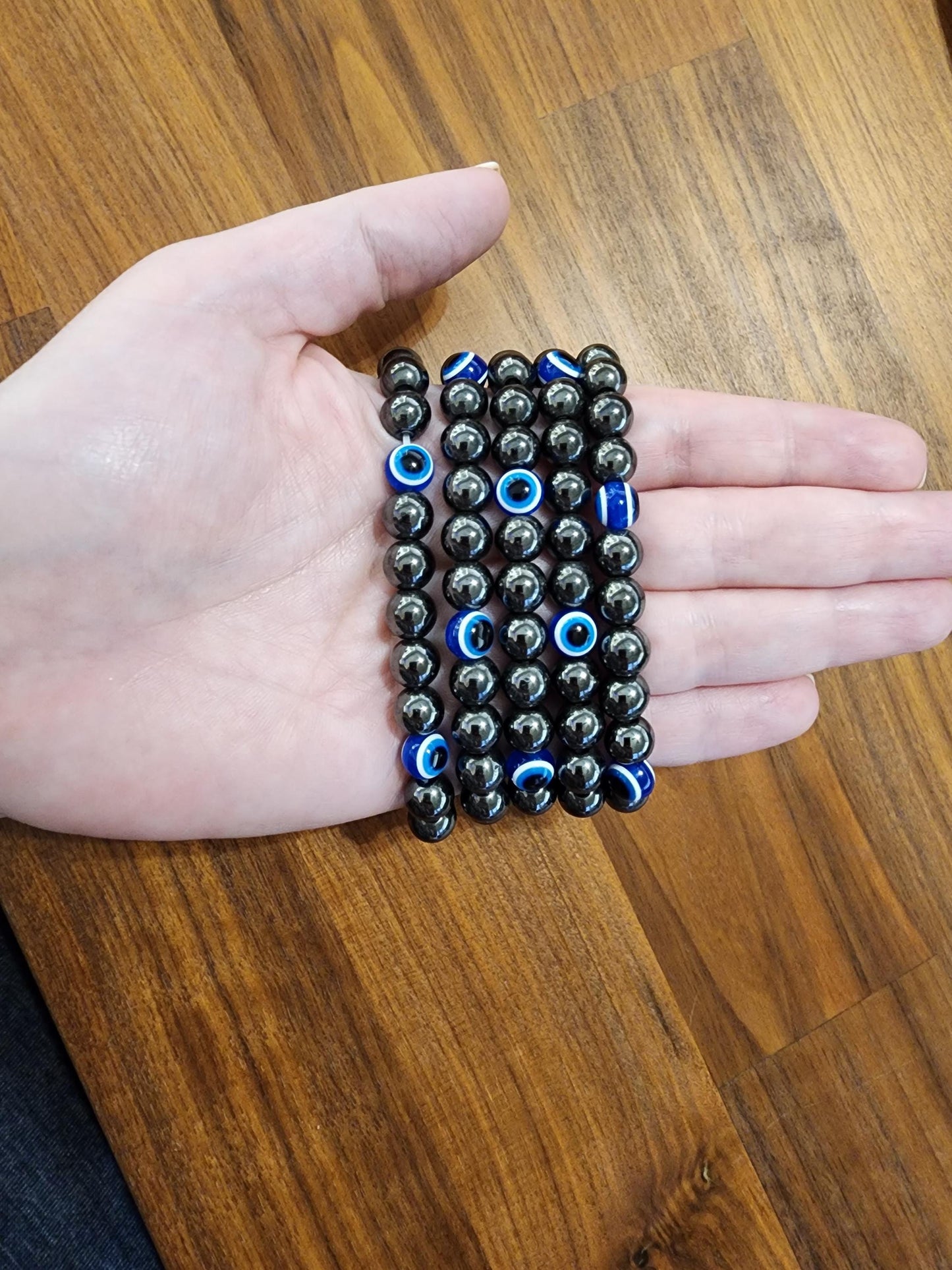 Evil Eye Hematite Bracelet: 8MM Tera Hertz Beads with Blue & Black Protection Charms