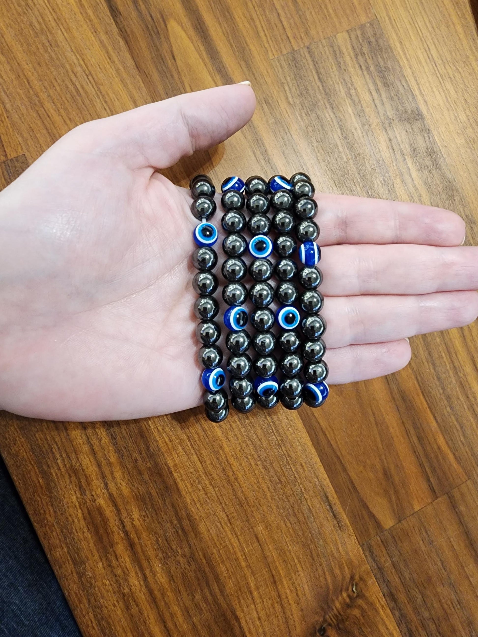 Evil Eye Hematite Bracelet: 8MM Tera Hertz Beads with Blue & Black Protection Charms