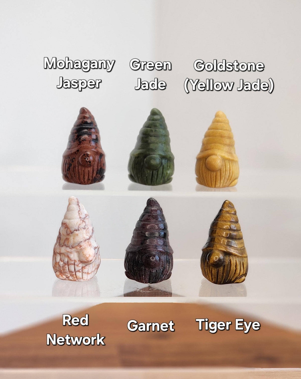 a collection of six unique gnome-shaped objects, each with a different color and pattern, arranged in a grid-like pattern.