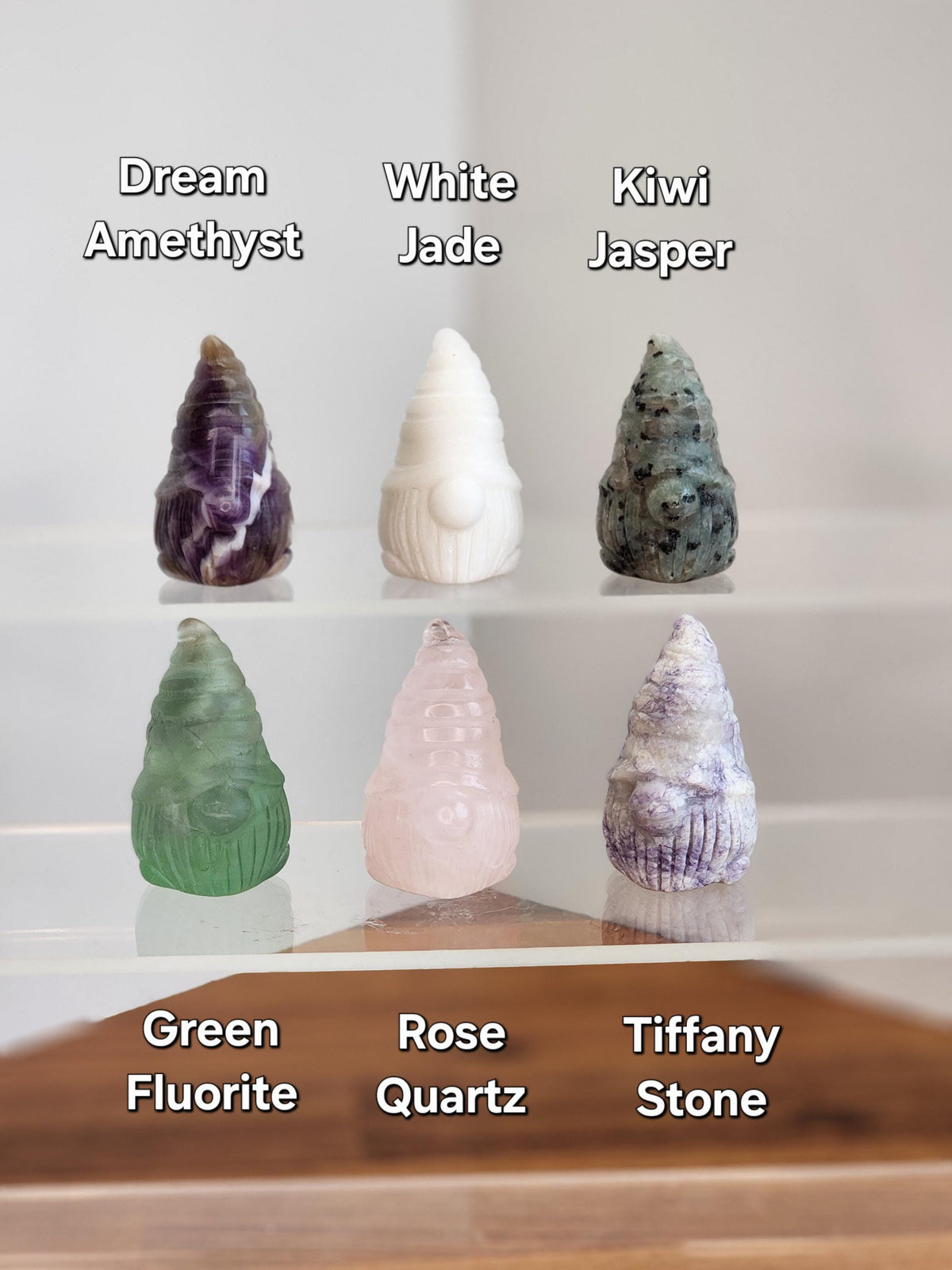 a collection of six unique gemstones, each with its own distinct color and shape, arranged in a grid-like pattern.
